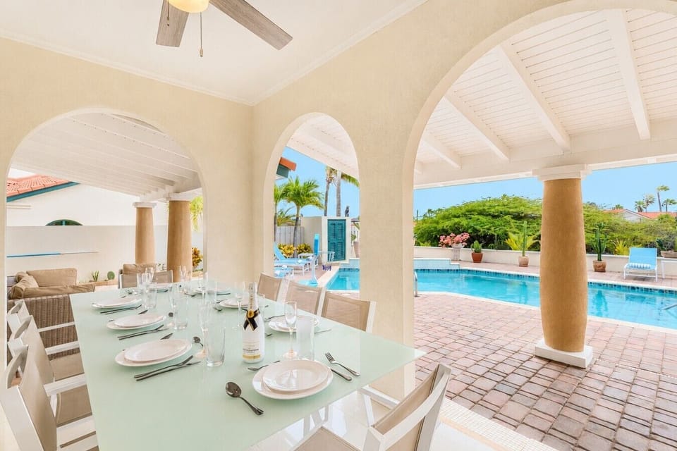 Spacious patio with comfortable seating, dining area, BBQ grill, and relaxing outdoor ambiance.(3)