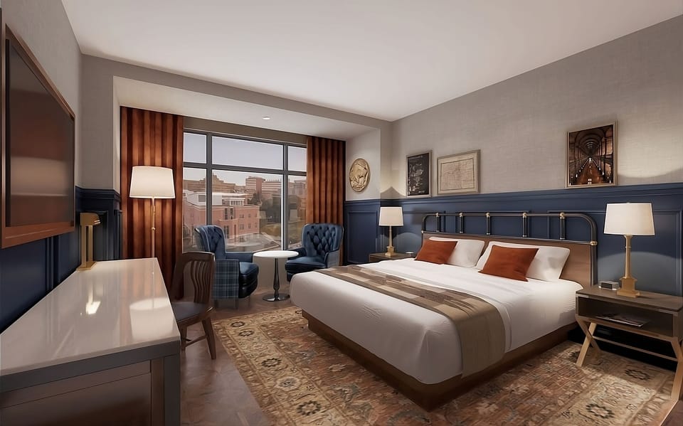 Recharge in a refined room with rich tones and views.