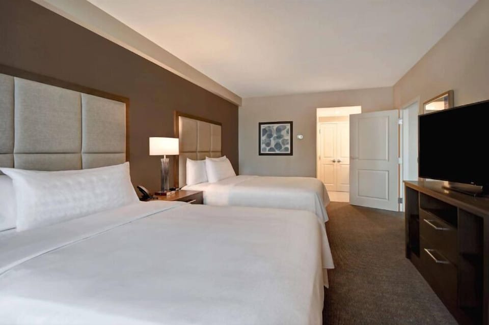 Settle in with two plush beds for effortless shared comfort.