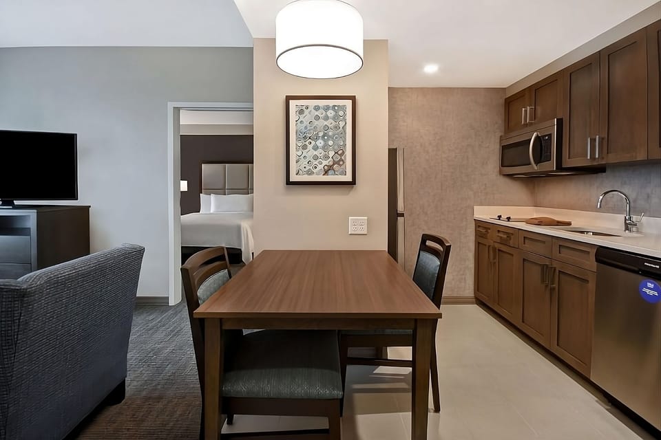 Gather for easy breakfasts at the dining table beside the kitchenette.