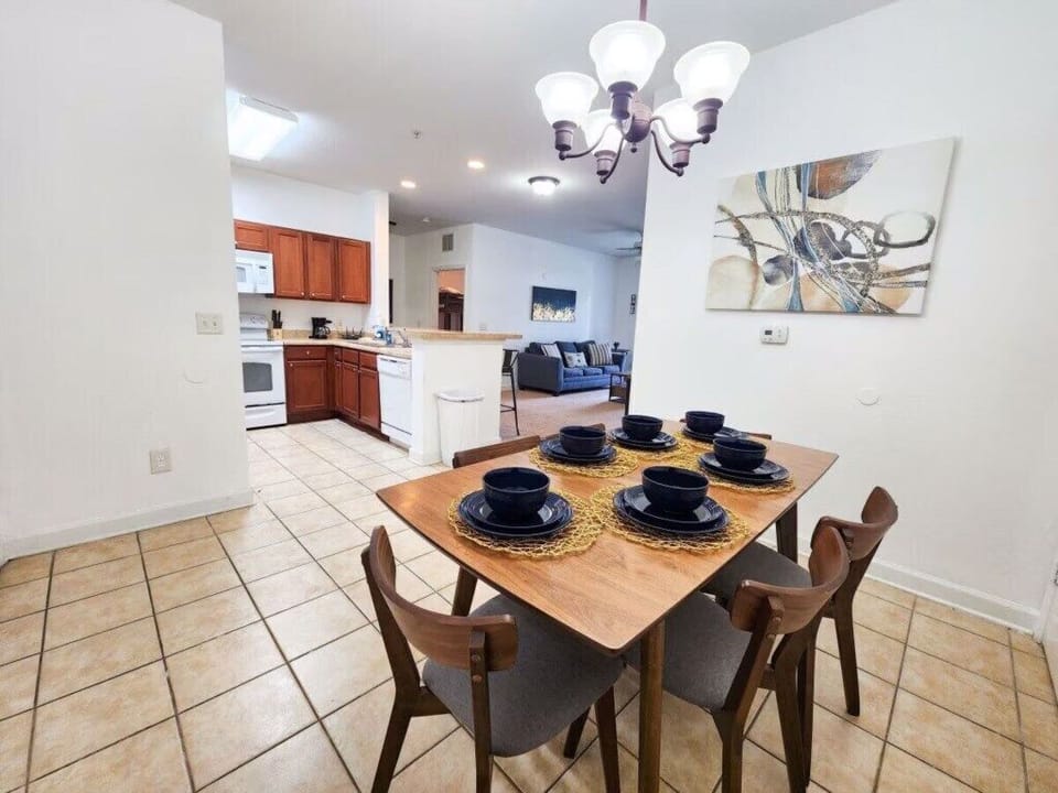 - Open dining area - modern setup for family meals connected to kitchen and living room near Disney World  

