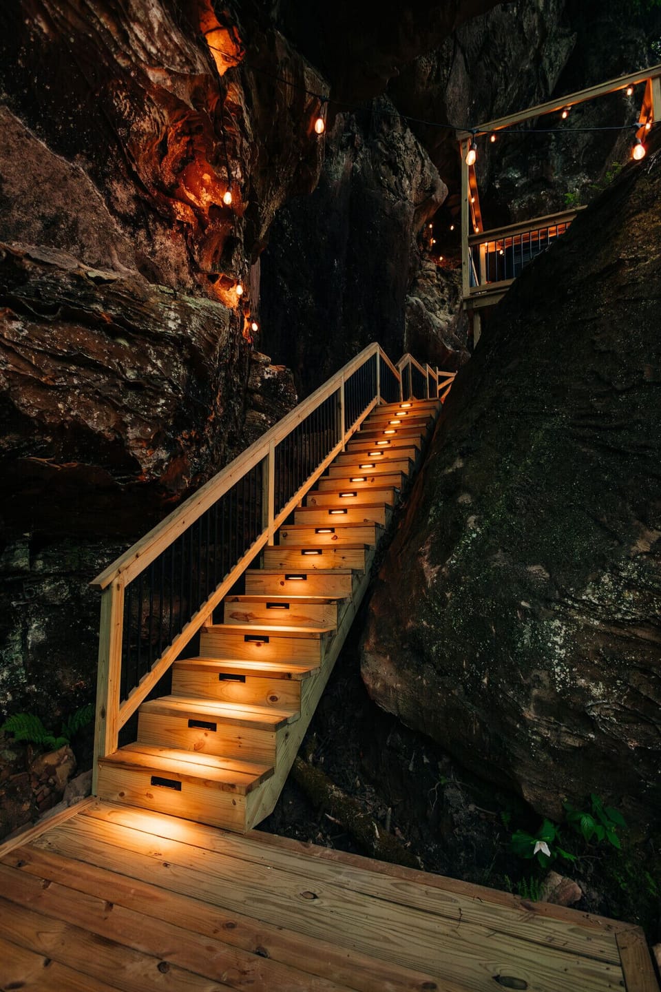 Night-lit steps lead into the cliff where you’ll find your hot tub, grill, and viewing deck.