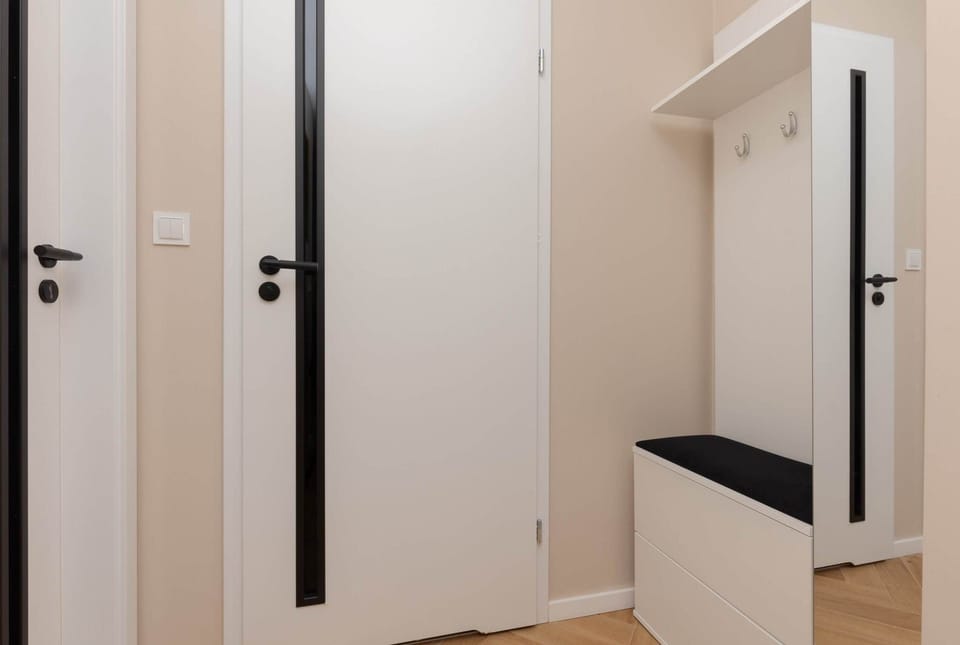 A bright hallway with storage space, leading to the various areas of the apartment in a clean and functional layout.






