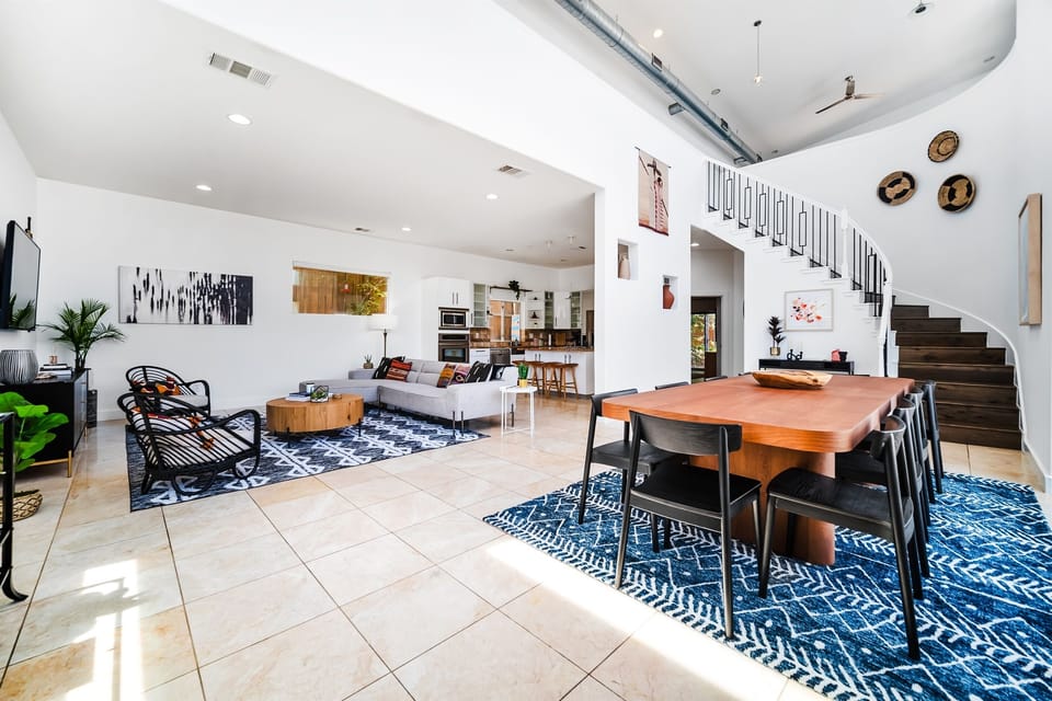 This captivating photo captures the seamless fusion of the dining area, living space, and sleek kitchen. An open-concept design that's both inviting and functional awaits your exploration.