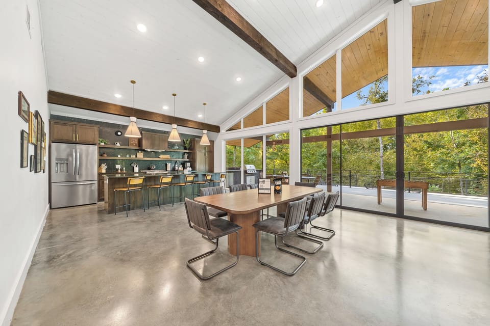 Dining Area: Indulge in meals with forest views and modern decor in this spacious retreat!
