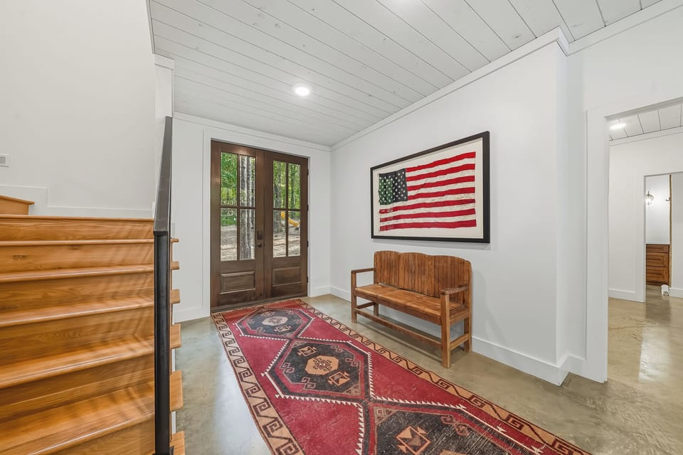 Entryway: A welcoming space featuring rustic decor and vibrant art, perfect for your adventure!