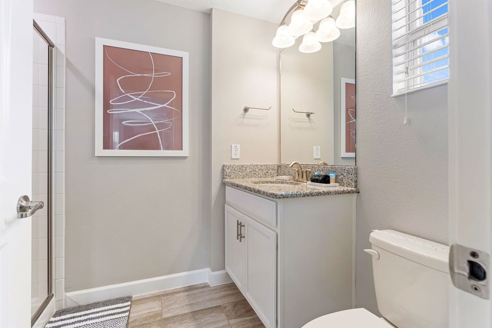 Bathroom attached to end of hallway master suite