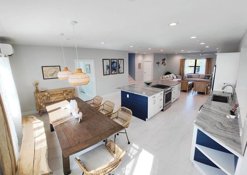 Casual dining with seating for 8. 4 additional seats at kitchen island.