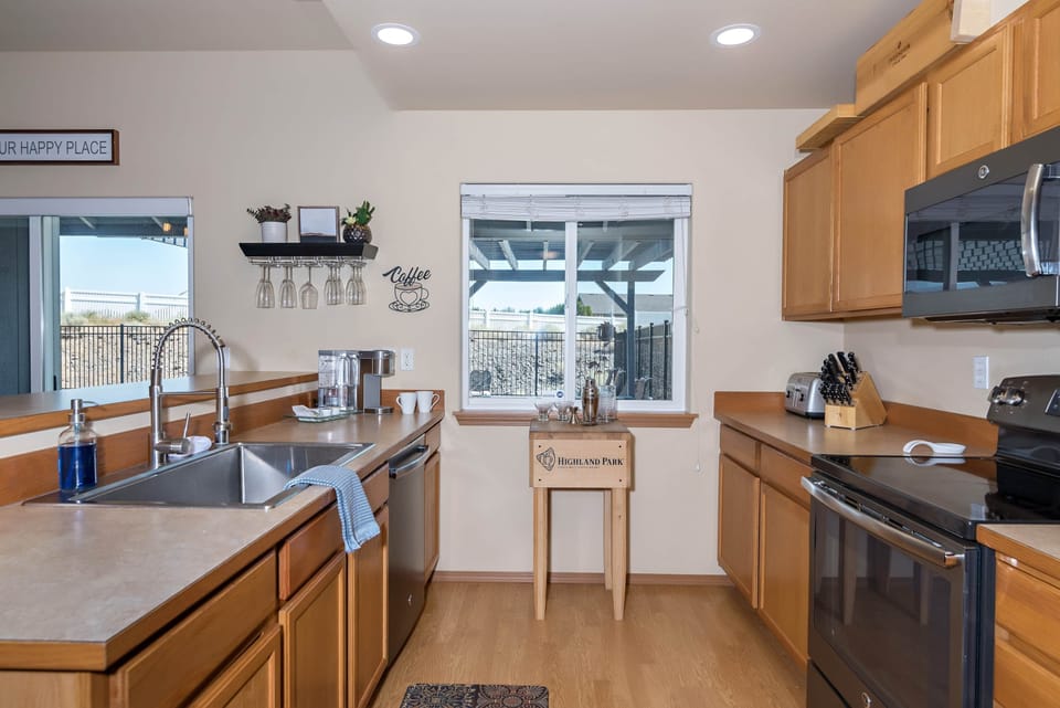 Fully equipped kitchen with Krup coffee maker, and newer appliances