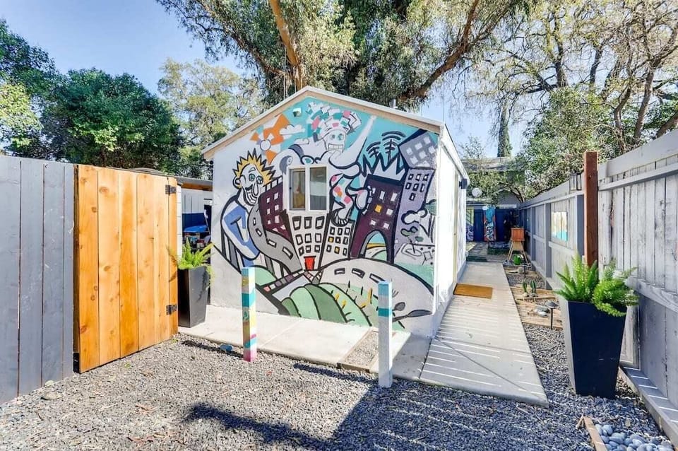 A joyful welcome to a tiny home in a fun city. 