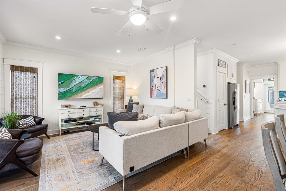 First Floor Living Room-Relax and recharge—literally! Our couch comes equipped with built-in USB ports, letting you unwind comfortably while keeping your devices charged for your convenience. There is also a tv, games and easy access to the front porch.