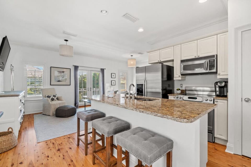 Welcome to our carriage house—a haven of convenience and comfort. This fully stocked kitchen is a culinary delight, equipped with a Keurig coffee pot and coffee pods. Equipped with full size appliances, it's a complete setup for preparing delicious meals!