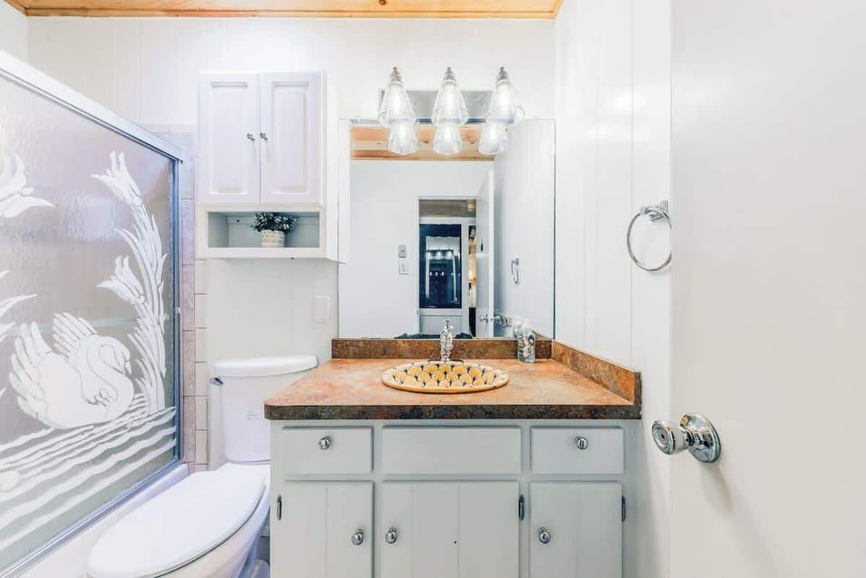 Full Bathroom shared between Bedroom 1 and 2 w/ Shower/Tub Combo