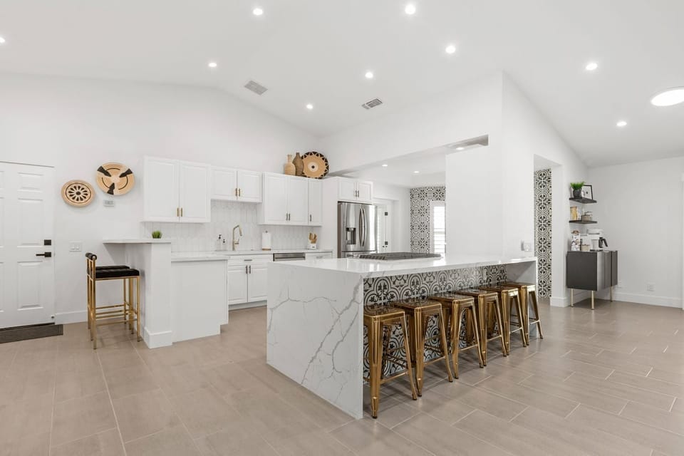 Completely redone kitchen, two kitchen bars with setting for 8. 