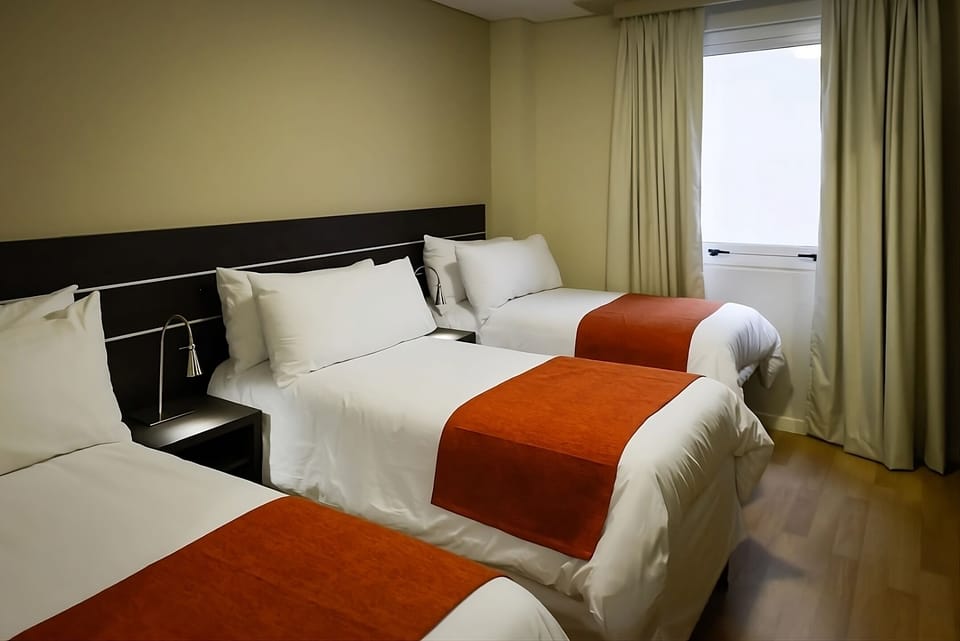 Settle into crisp linens and restful triple-bed comfort.