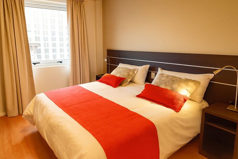 Drift off comfortably beside the window in crisp linens.