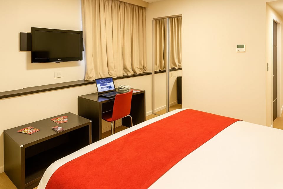 Unwind after meetings with a dedicated desk and flat-screen.