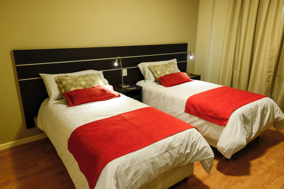 Relax under warm lights in a cozy, quiet twin room.