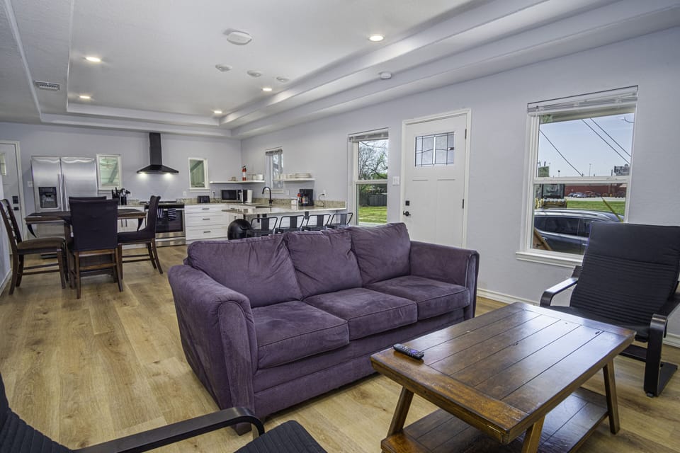 Spacious open-concept living room connected with the kitchen