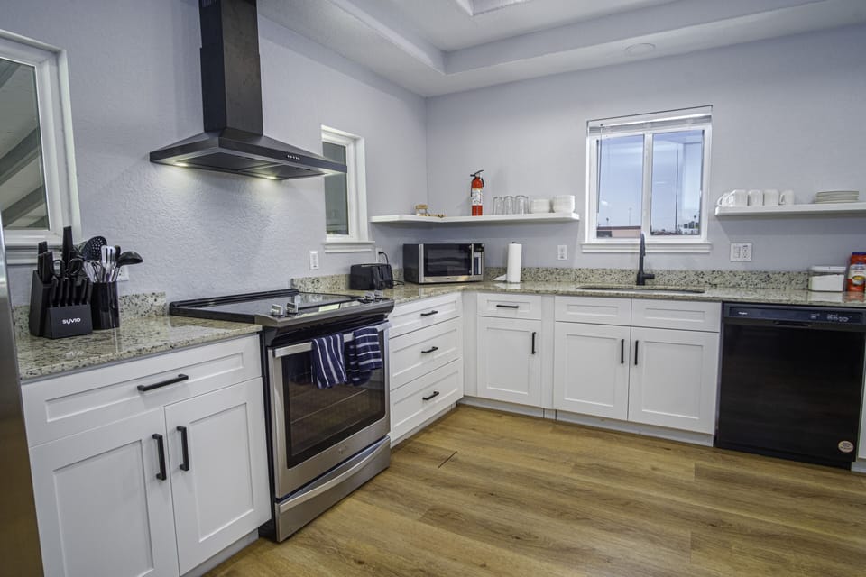 Stove/oven, toaster, microwave, and dishwasher.  Pots,pans and cooking utensils