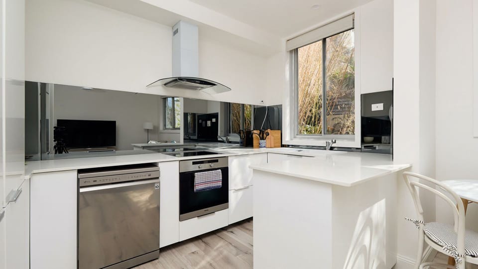 Effortlessly prepare meals in our sleek kitchen, complete with modern amenities and ample space for culinary creativity