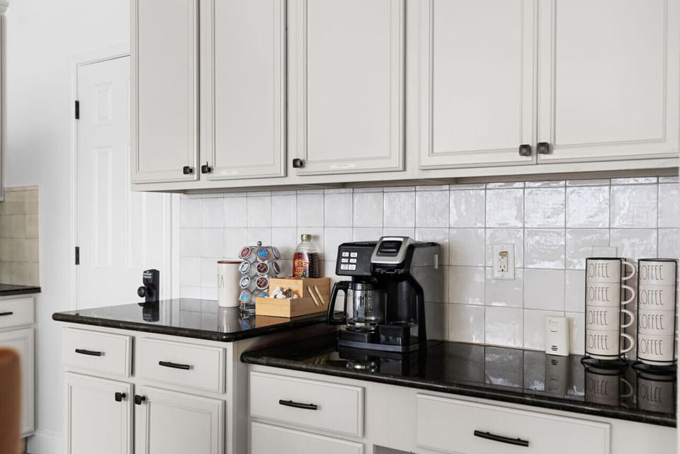 Kitchen: Whip up culinary delights in this bright space with modern appliances and sleek design!