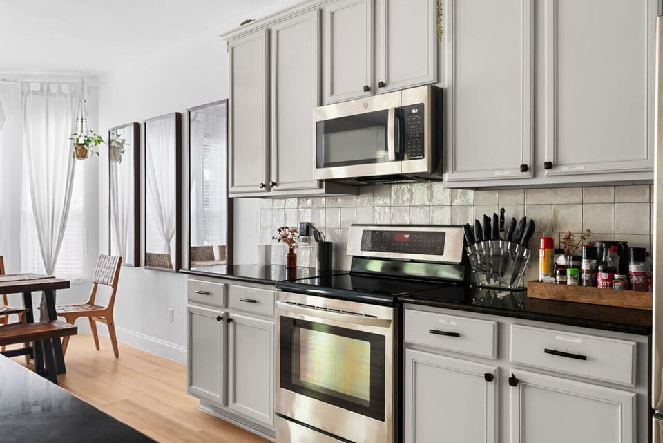 Kitchen Delight: Modern appliances and bright windows create a perfect space for culinary adventures!