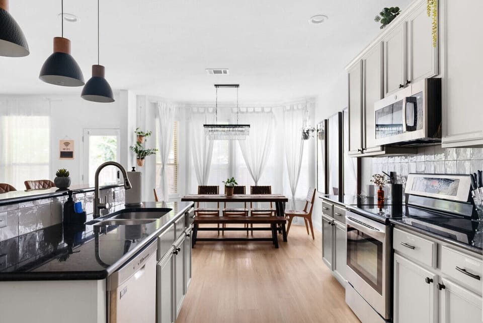 Kitchen: Bright and airy space with sleek finishes, perfect for culinary adventures!