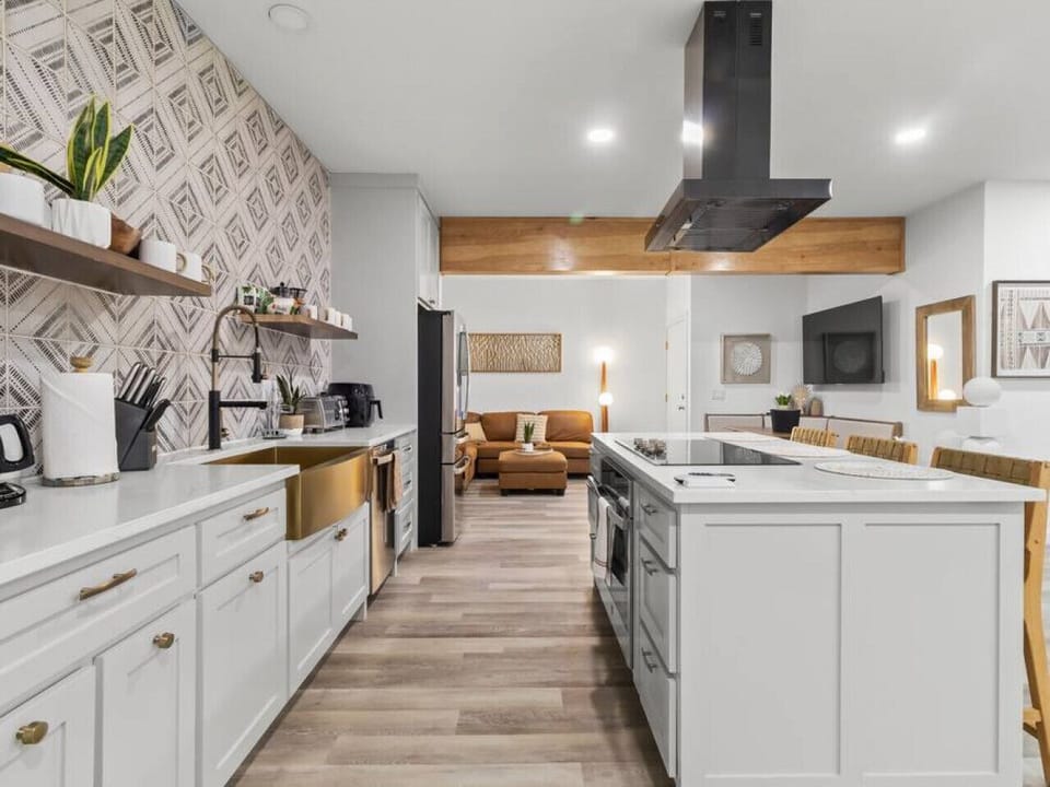 Main floor; Kitchen area - smartly organized with dedicated zones for cooking, prepping, and cleaning, ensuring a clutter-free and functional culinary workspace.