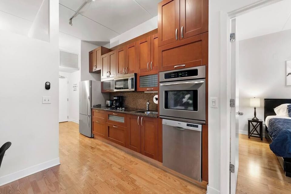 Sleek kitchen view highlighting clean counters and efficient layout.