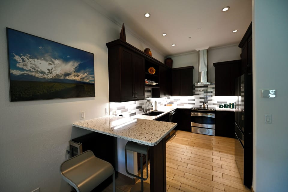 Kitchen with new backsplash and under cabinet lighting. 
