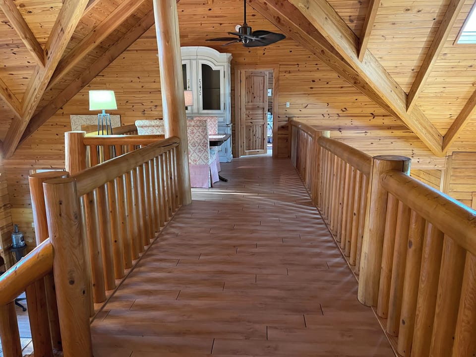 Cathedral ceiling and catwalk overlooking great room