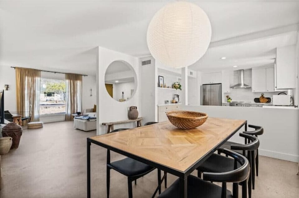 Seating for 6 at the dining table which is open to the kitchen and living room.