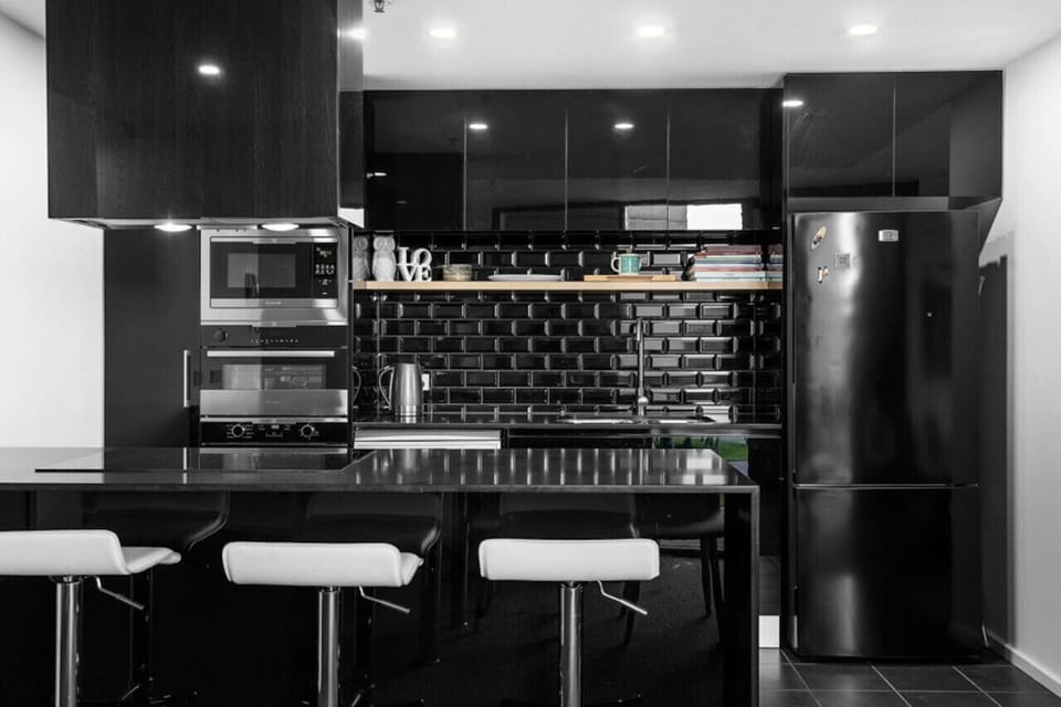 Step into a contemporary fully equipped kitchen, complete with modern appliances and stylish finishes that make cooking and entertaining a breeze.