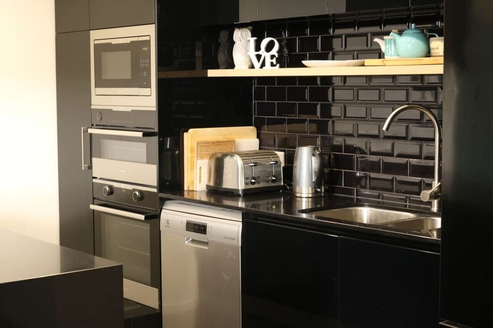 Step into a contemporary fully equipped kitchen, complete with modern appliances and stylish finishes that make cooking and entertaining a breeze.