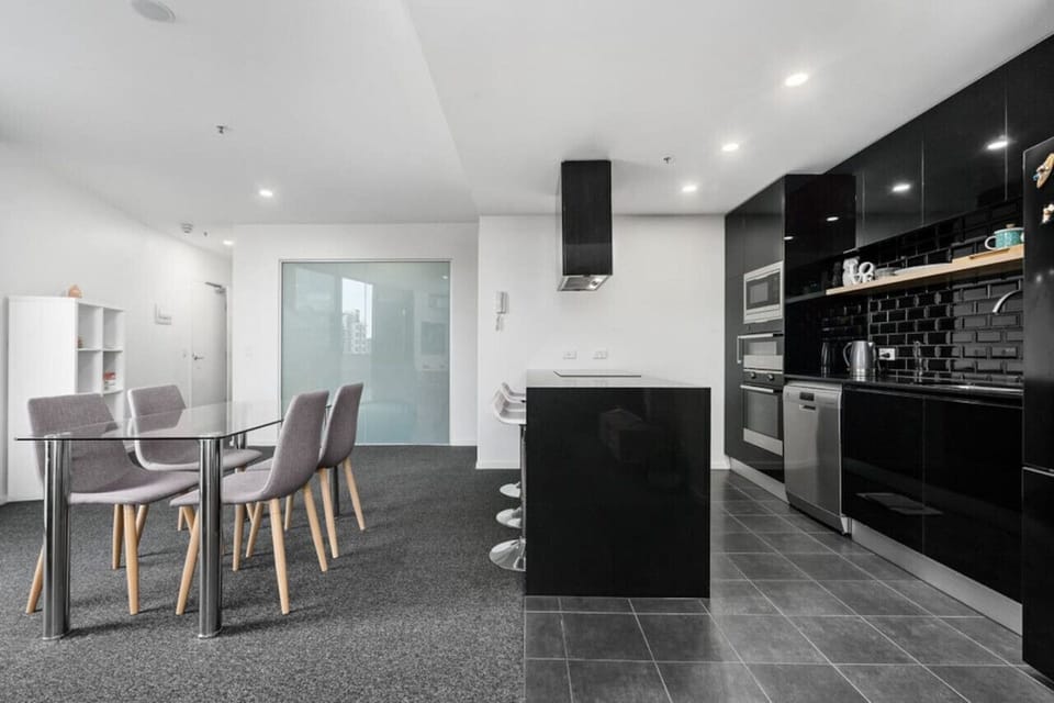 Experience the elegance of a black-and-white apartment, where contemporary design and classic color contrasts create a refined and timeless living space.