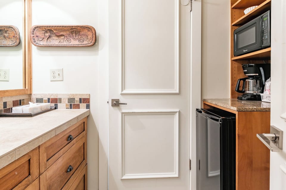 Bathroom w/ mini fridge, microwave, coffee maker