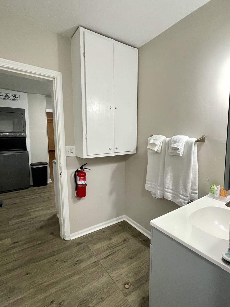 Fire extinguisher; view out of bathroom to laundry and kitchen