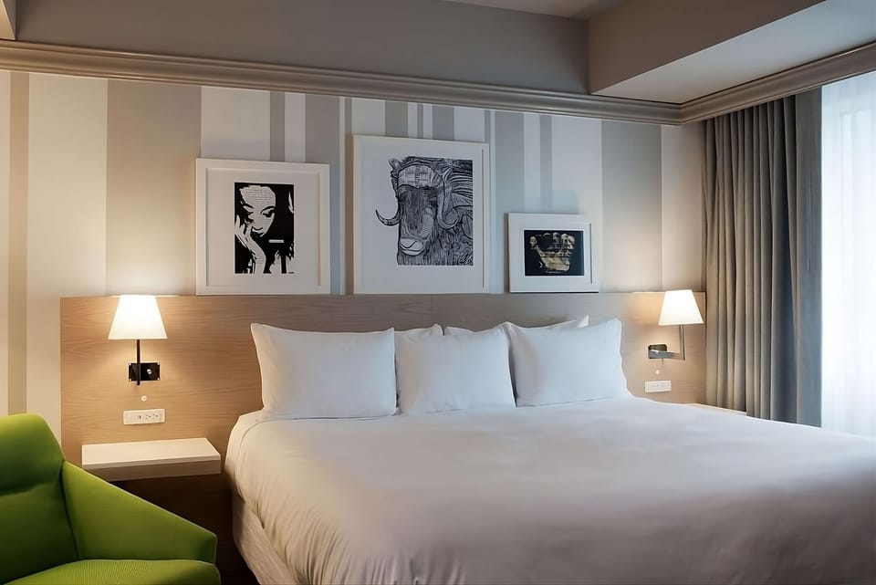 Sink into crisp linens and drift off under soft sconces.