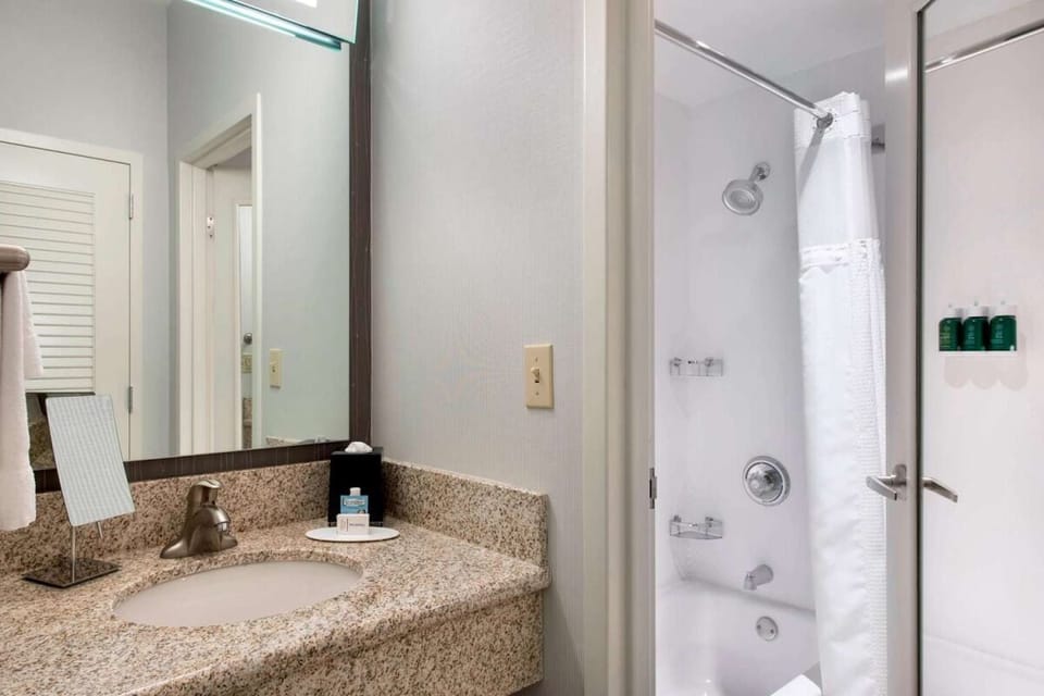 Refresh easily with bright vanity space and a hot shower.