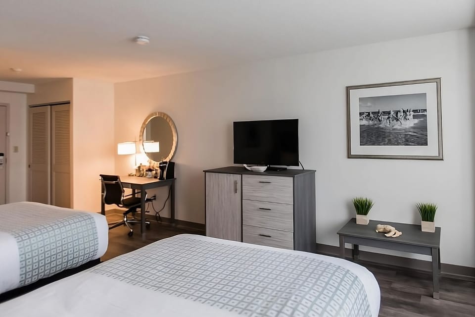 Unwind with your favorite shows and a convenient in-room workspace.