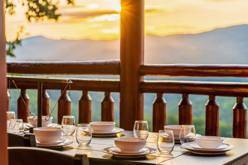 Outdoor dining and group game fun with sunset backdrop