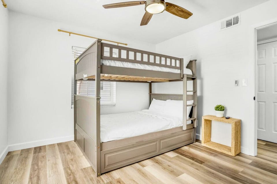 Experience a peaceful and relaxing sleep in this spacious bedroom featuring bunk bed