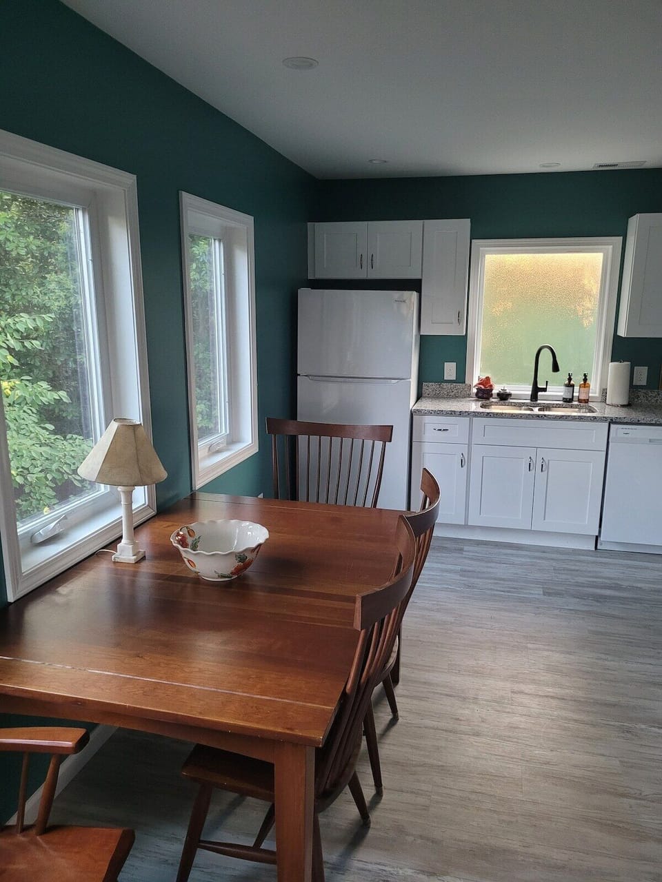 Spacious dining table overlooks the back yard and double as a work space.
Enjoy the natural light!