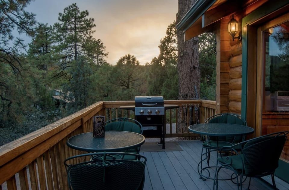Elevated outdoor deck and propane grill.