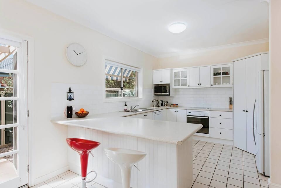 Pull up a stool at the kitchen island for a quick meal or a friendly chat with the chef.