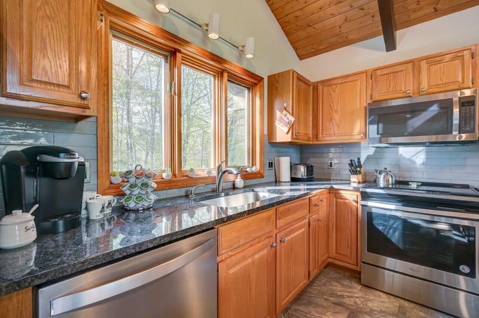 Open kitchen with new appliances and everything you need to entertain and cook.
