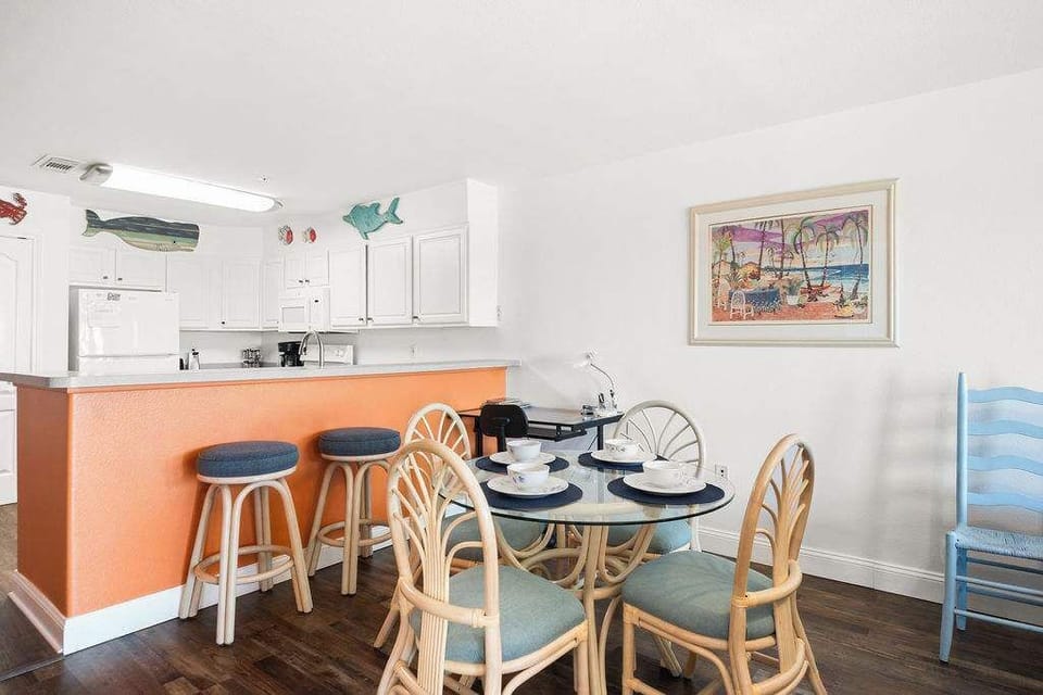 Enjoy meals together with dining for 4, perfectly connected to the fully equipped kitchen—ideal for a seamless dining experience.
