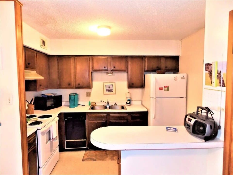 Compact yet fully equipped - our kitchen maximizes efficiency without compromising on functionality.