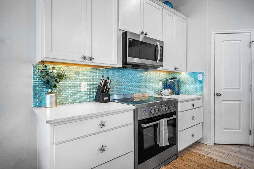 Experience culinary excellence in our modern kitchen, complete with a spacious pantry for all your storage needs.